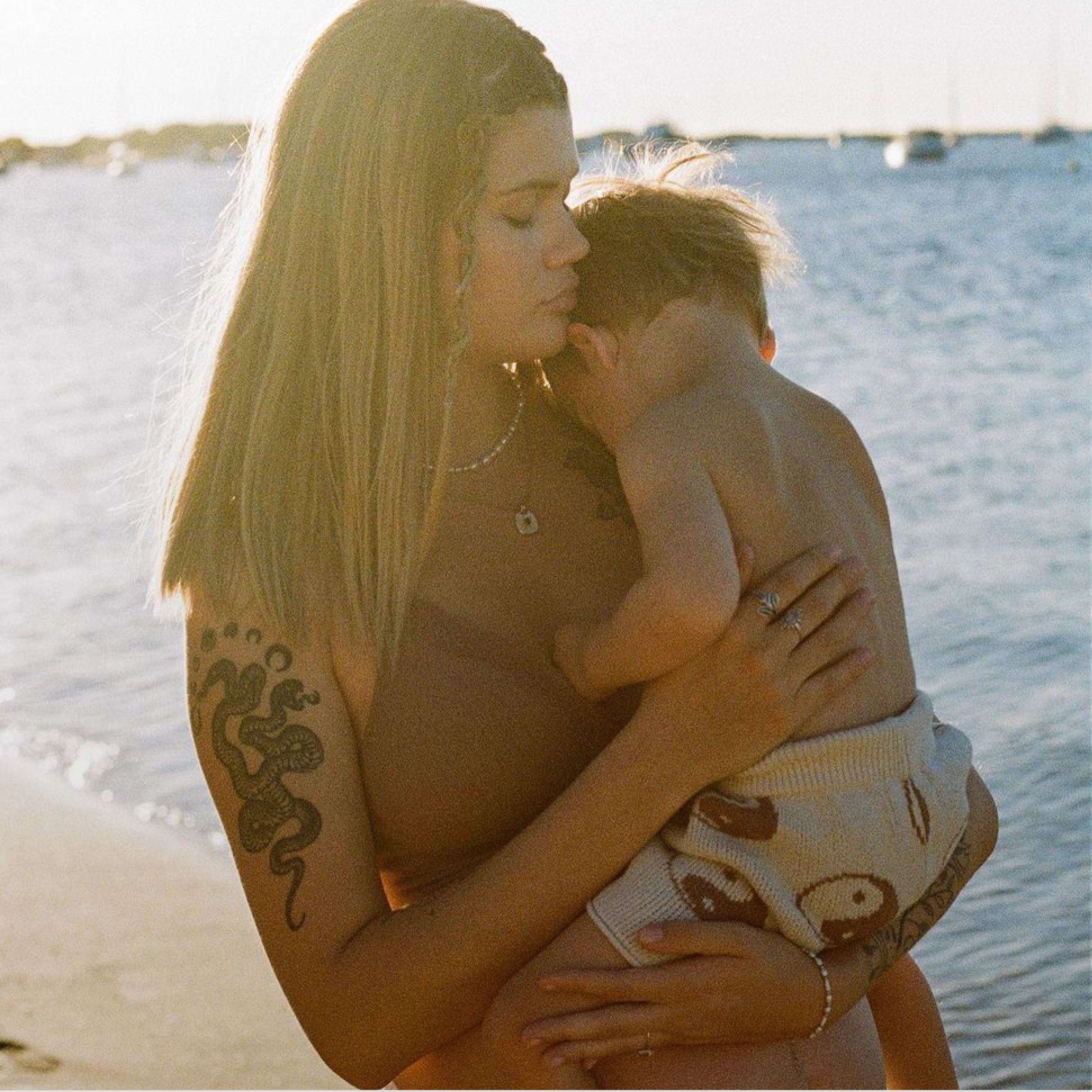 woman sitting breastfeeding her baby