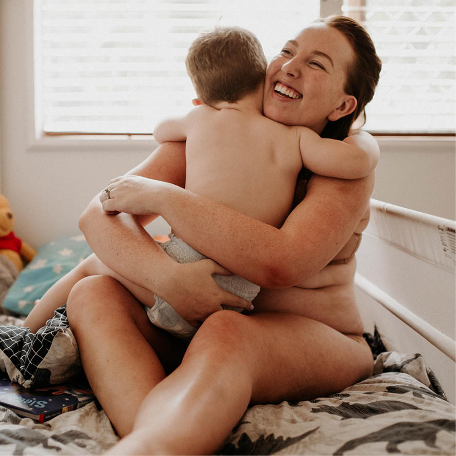 woman sitting breastfeeding her baby