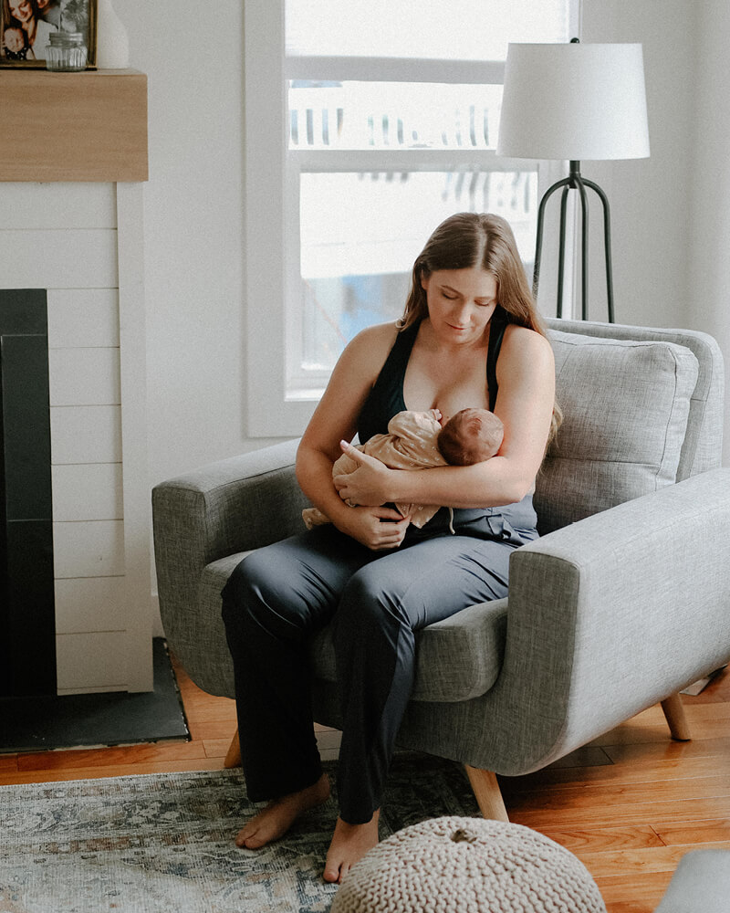 woman breastfeeding her baby