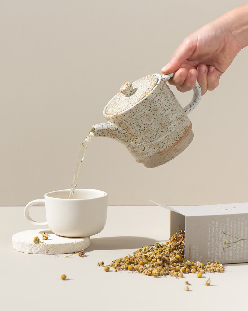 pouring pregnancy tea in a tea cup