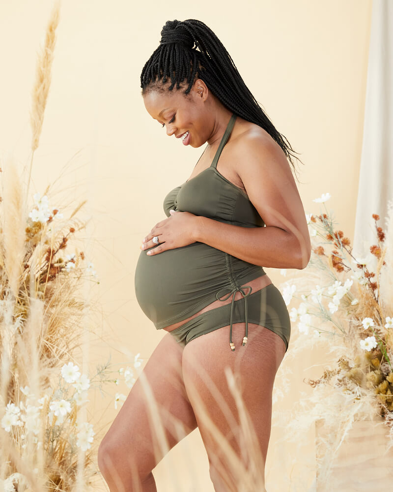 pregnant woman wearing coconut maternity tankini