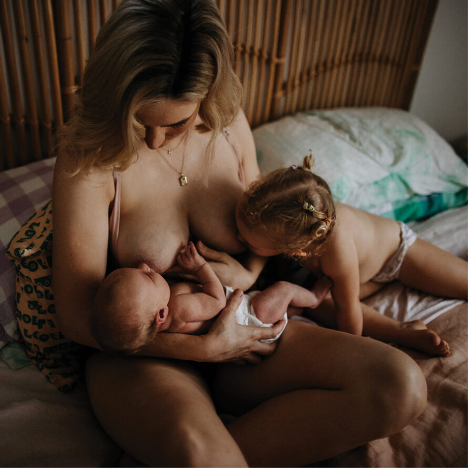 mother breastfeeding her children