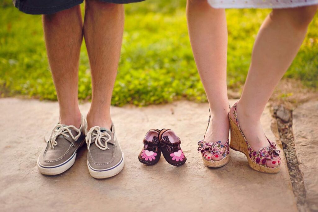 couple with baby shoes