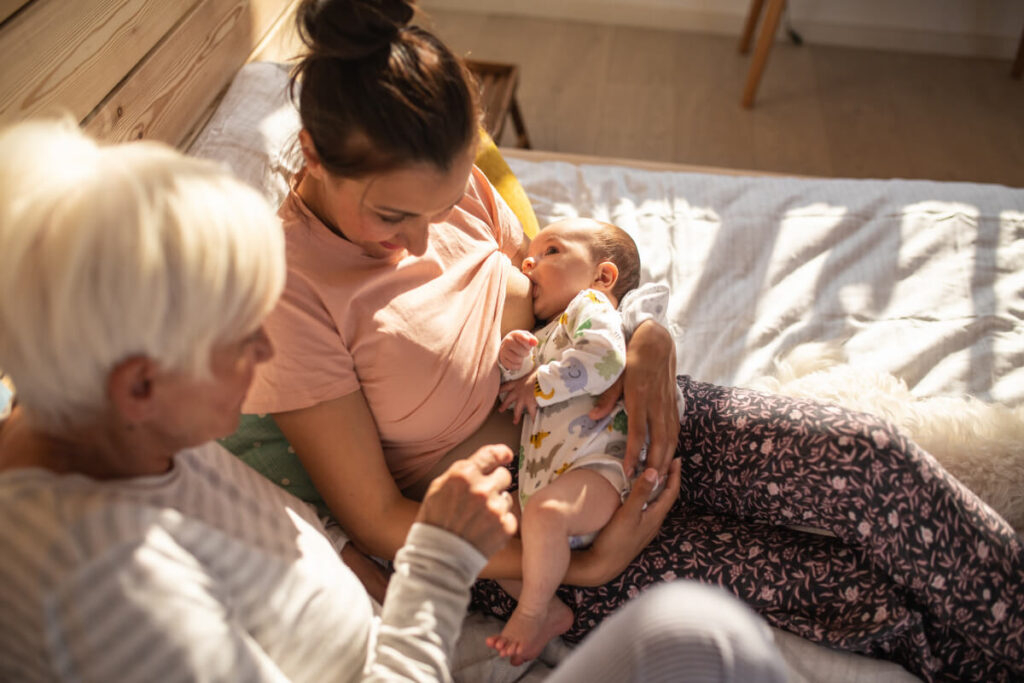 breastfeeding mama with family