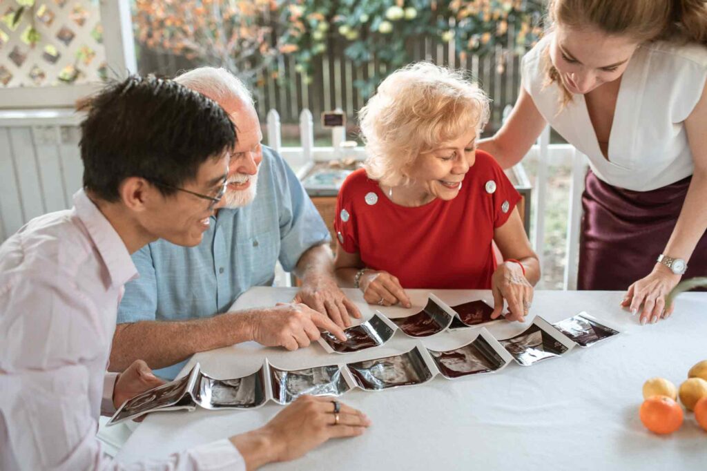 family looking at pregnancy scans