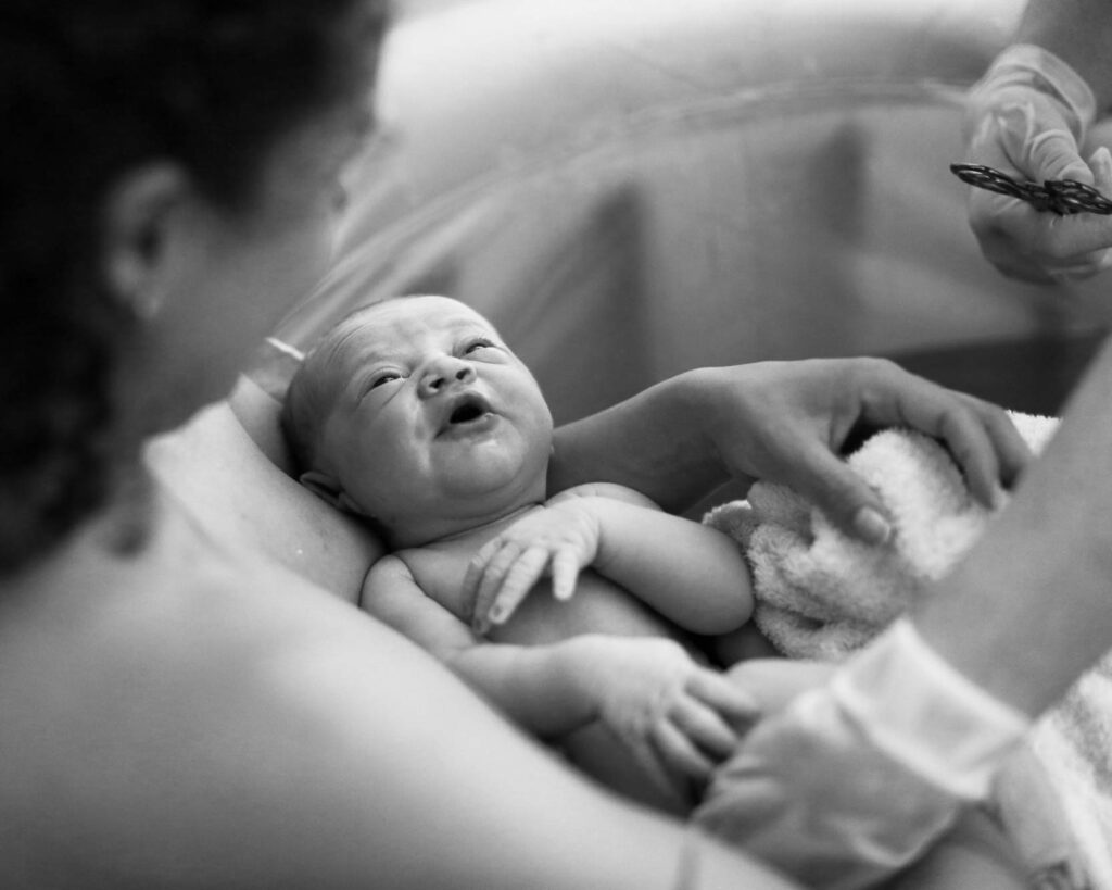 newborn baby in birth pool