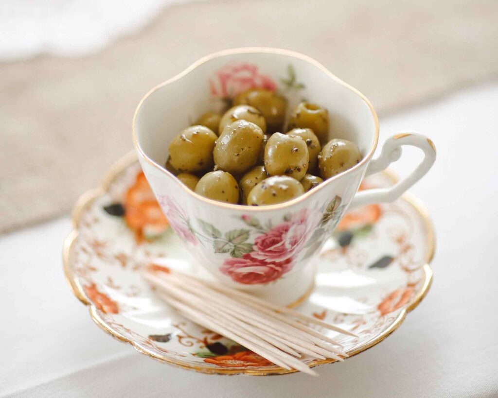 a cup of green olives