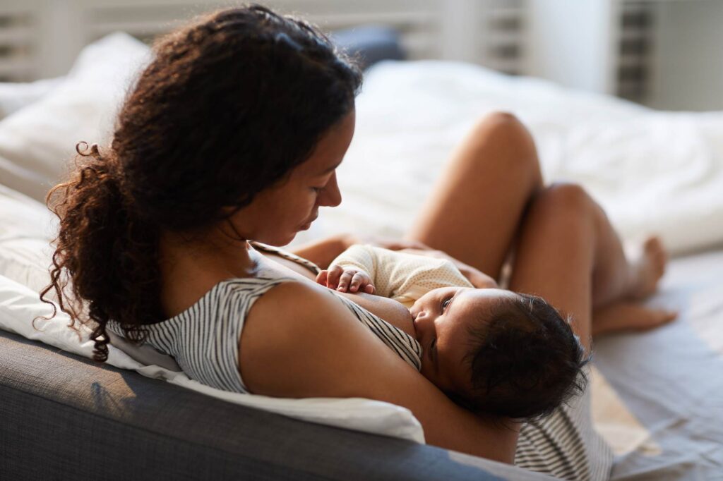 woman breastfeeding child