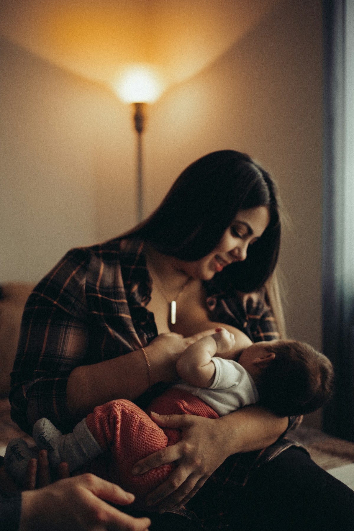 woman breastfeeding her baby