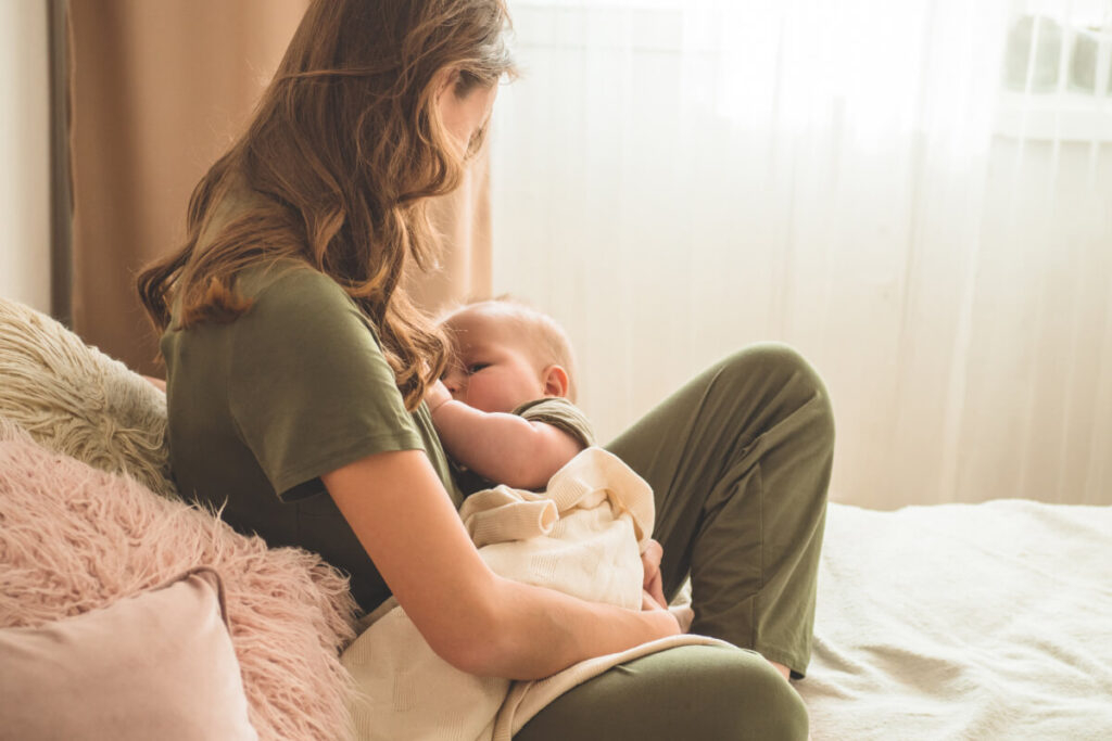 woman breastfeeding in bed