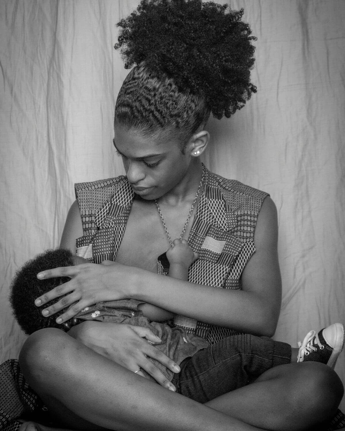 woman sitting breastfeeding baby